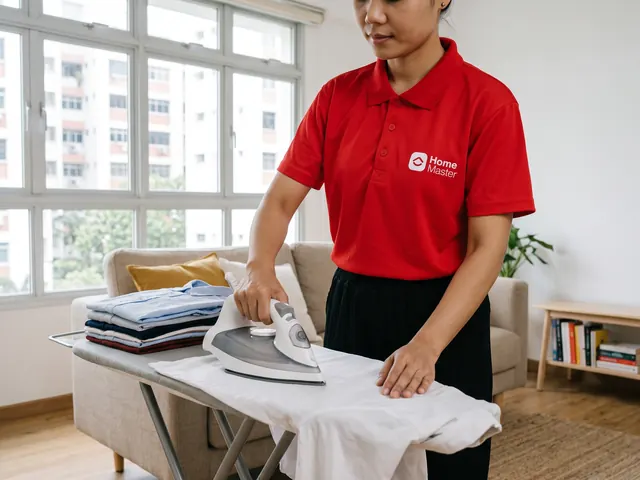 An Expert ironing a white shirt beside a stack of folded shirts